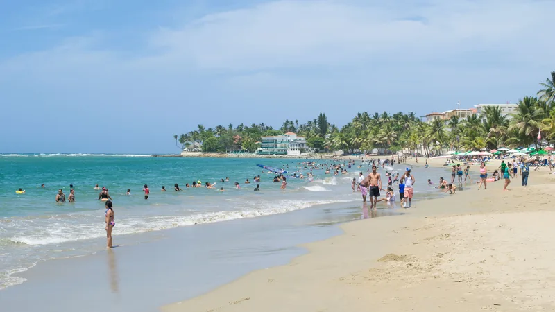 Kitesurfers riding the reliable afternoon trade wind off Cabarete, fifteen minutes east of Sosúa